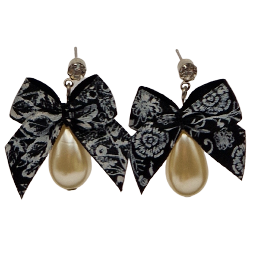 Ivoorkleurige oorbellen met zwarte strikjes